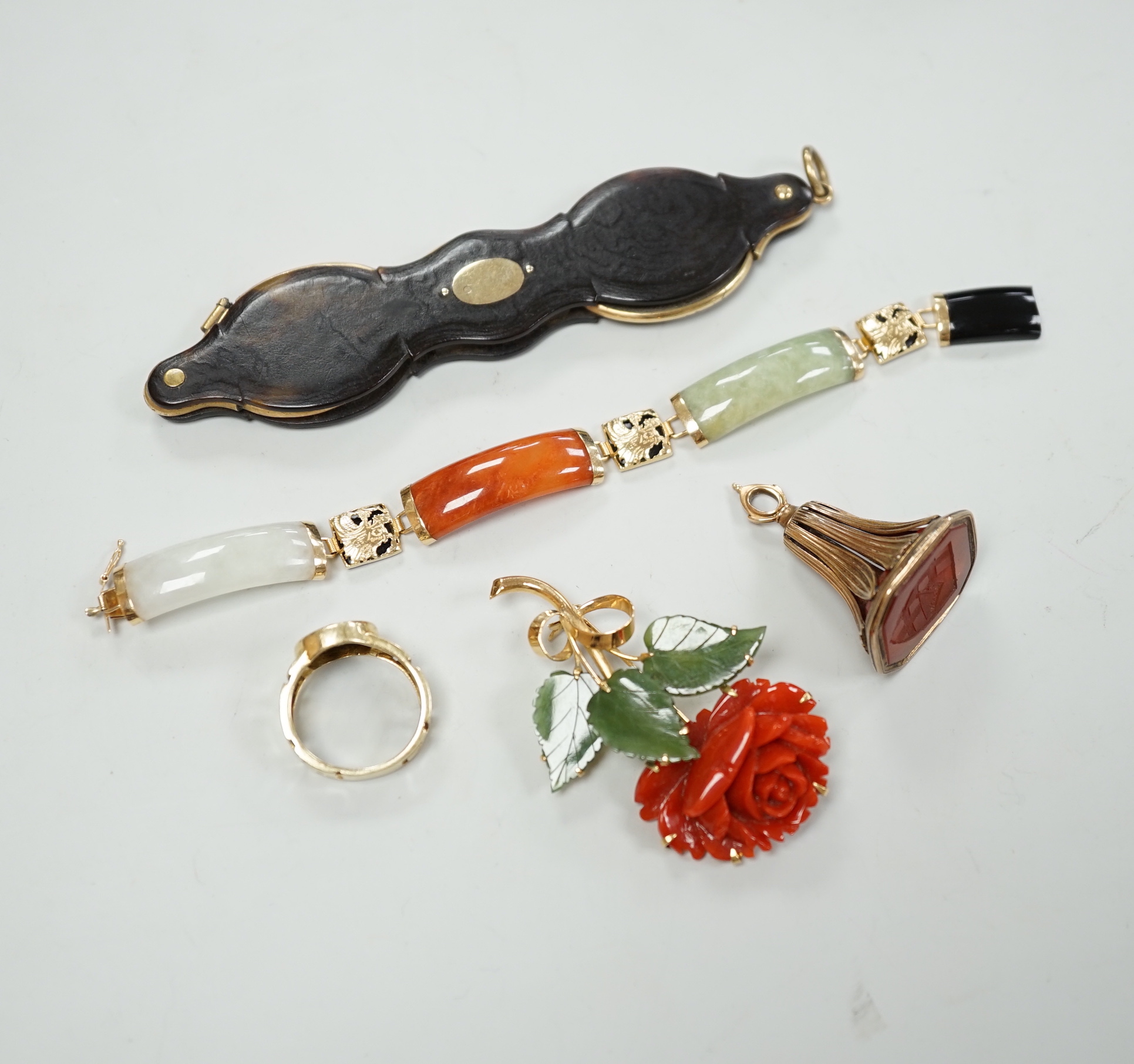 A 19th century yellow metal overlaid and carnelian set fob seal, 39mm, a 585 ring with bust, a pair of tortoiseshell mounted lorgnettes, an 18k coral and green hardstone set rose brooch and a yellow metal and hardstone b